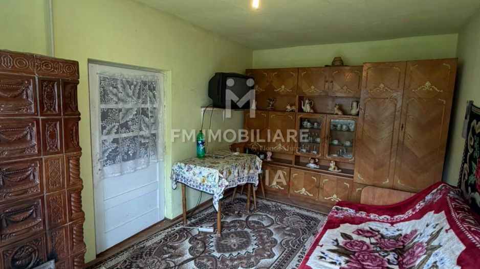 Casă cu teren generos în Buciumi - Poză 4
