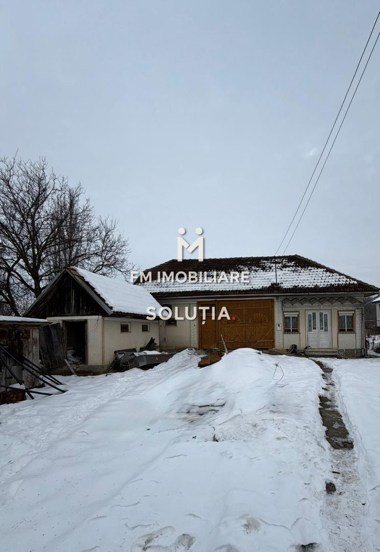 Casă cu teren generos în Buciumi - Poză 1