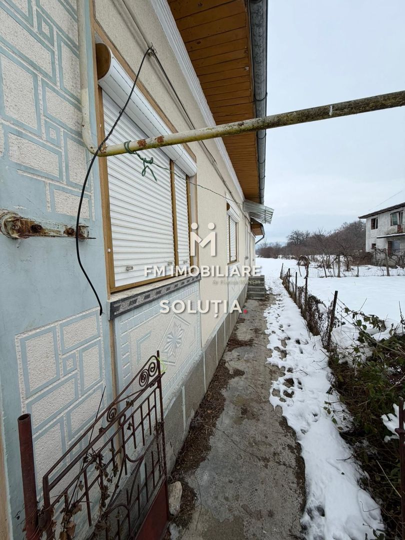 Casă cu teren generos în Buciumi - Poză 6