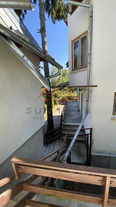 Vila de vanzare, teren 3100 mp, 7 camere, 6 grupuri sanitare, 3 CT, an 1997 - Poză 59