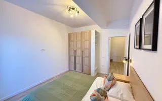 Casa moderna si cocheta. Locatie excelenta. Curte amenajata. Loc de parcare. - Poză 18