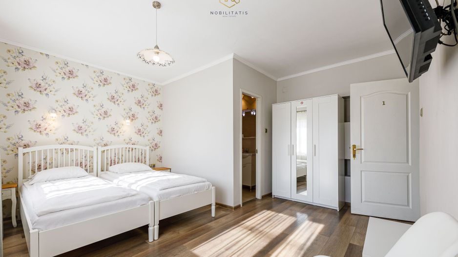 Proprietatea ideala pentru investiție, spații generoase, teren 1.200mp - Poză 2