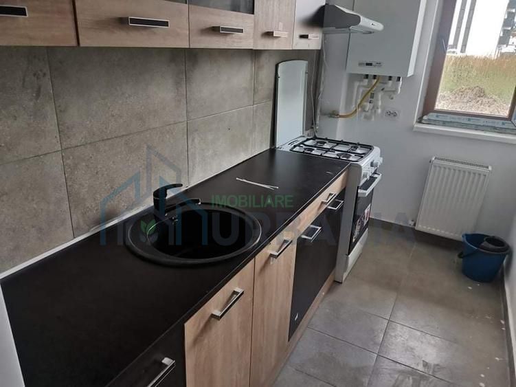 închiriez apartament cu o camera - Poză 10