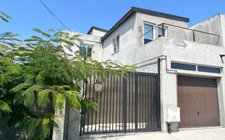 Casă P+1E cu terasă circulabilă, garaj amenajat și finisaje moderne - Poză 1