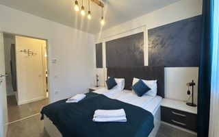 Apartament mobilat-utilat, cu 2 camere, balcon, parcare si boxa - Poză 2