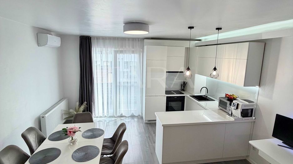 Apartament modern, 2 camere, parcare subterană,  zonă linistita. - Poză 1