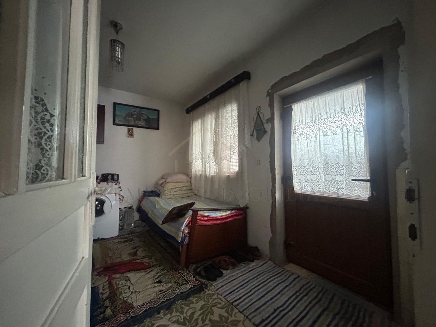 Casă batraneasca+ teren 999 mp intravilan în Oituz - Poză 8