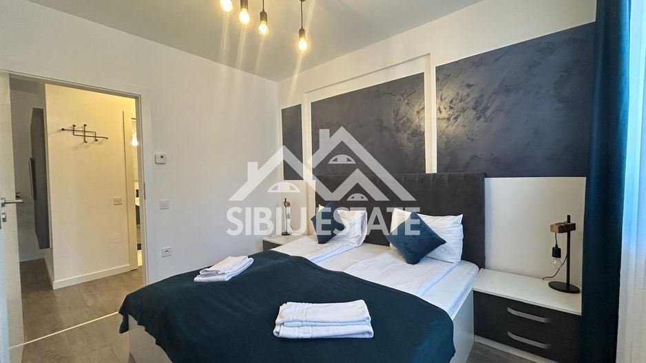 Apartament mobilat-utilat, cu 2 camere, balcon, parcare si boxa - Poză 2