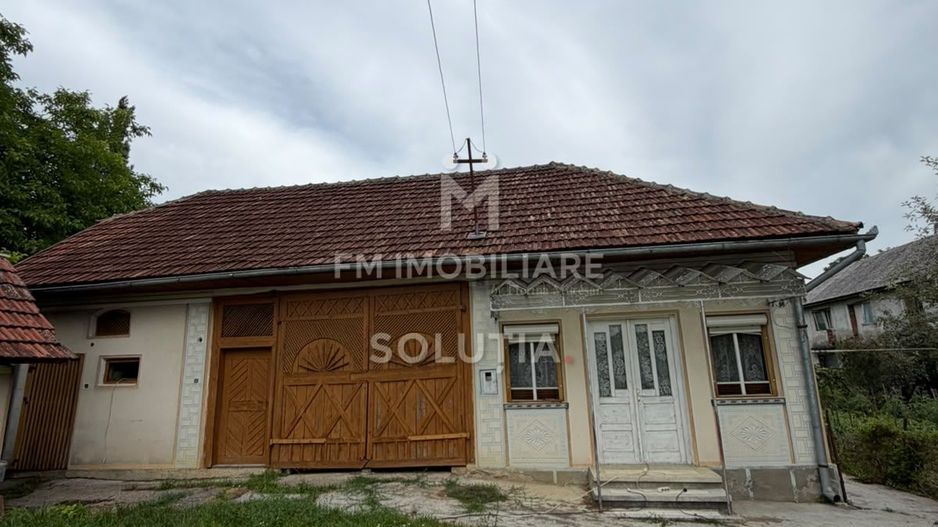 Casă cu teren generos în Buciumi - Poză 2