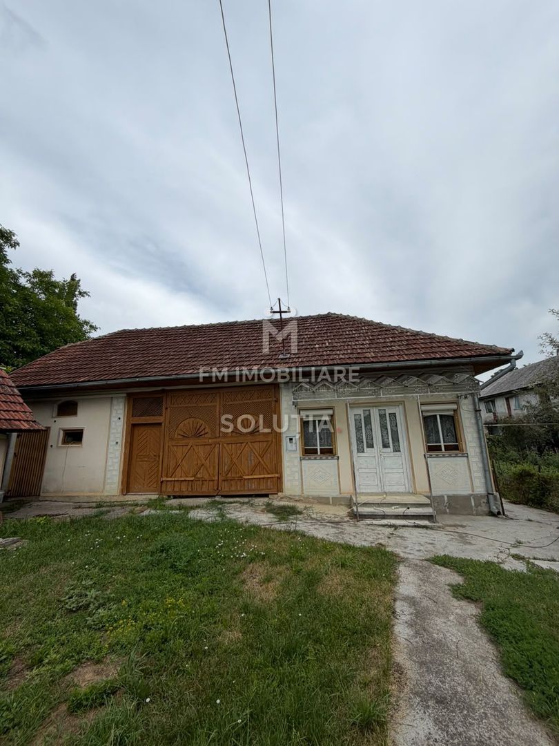 Casă cu teren generos în Buciumi - Poză 2