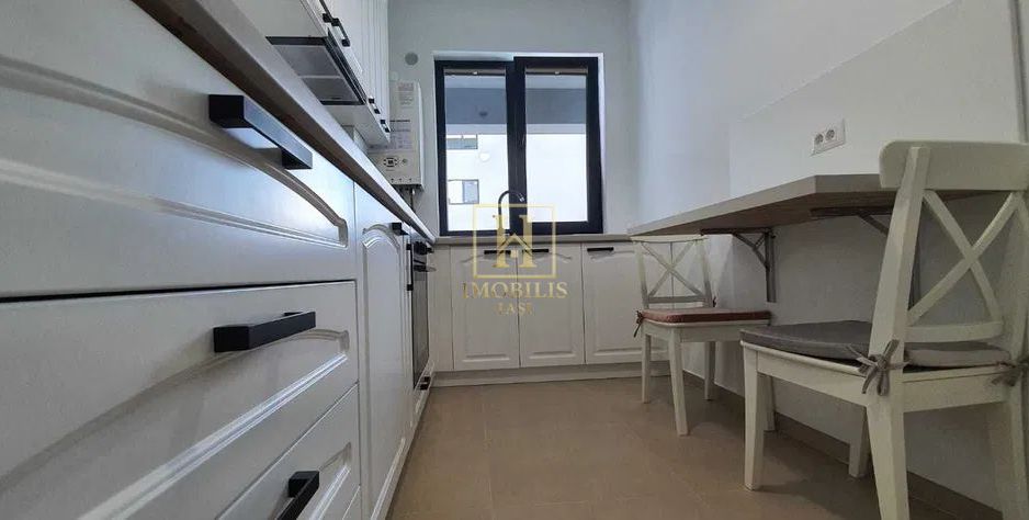 Apartament 2 camere,Dec.,54.6 mp Pacurari 133000 euro + loc de parcare - Poză 2