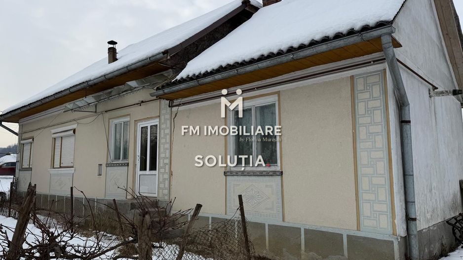 Casă cu teren generos în Buciumi - Poză 4