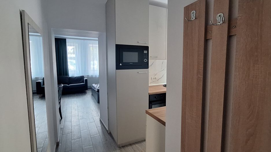Apartament central cu o camera si loc de parcare - Poză 2