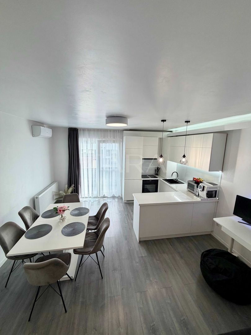 Apartament modern, 2 camere, parcare subterană,  zonă linistita. - Poză 1