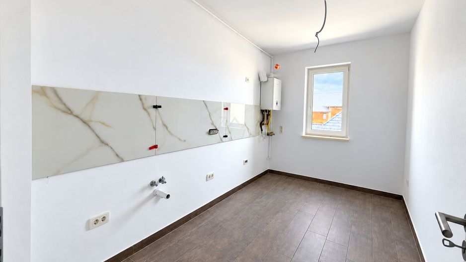 Apartament nou cu bucatarie inchisa. Clima. Langa magazin si transport in comun. - Poză 4