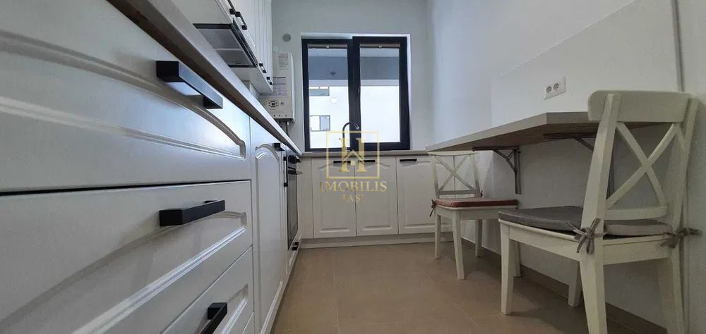 Apartament 2 camere,Dec.,54.6 mp Pacurari 133000 euro + loc de parcare - Poză 2