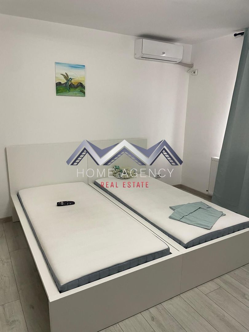 Garsonieră cu bucătărie închisă | include parcare - Poză 1