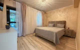 Casa P+1+M cu teren de 650 mp, piscina si curte complet amenajata - Poză 20