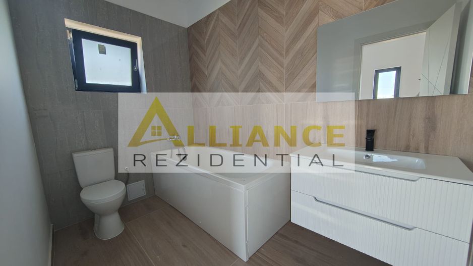Casa pe parter cu 3 camere, 2 bai si teren de 375 mp - Poză 10