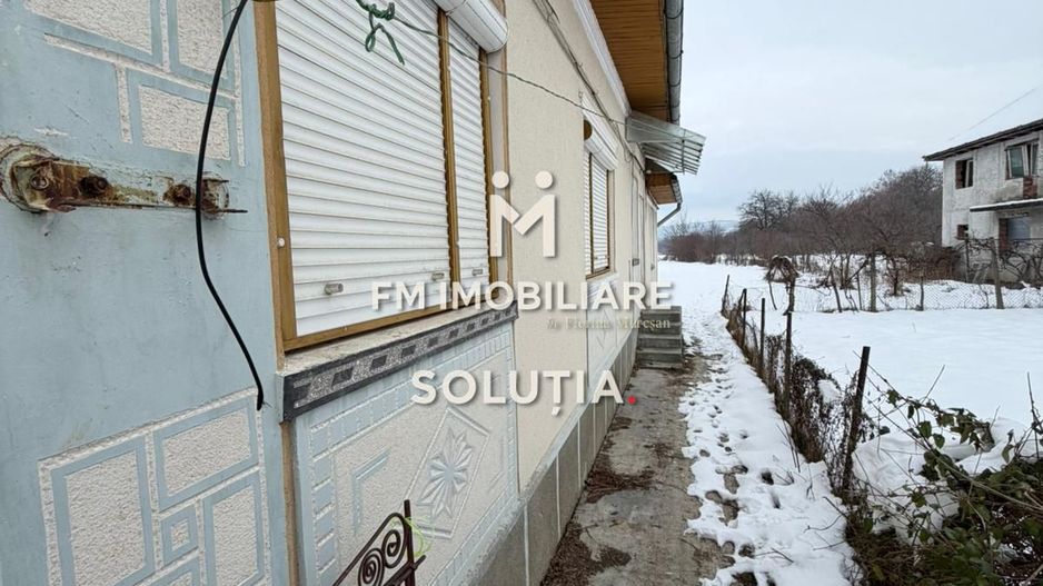 Casă cu teren generos în Buciumi - Poză 6