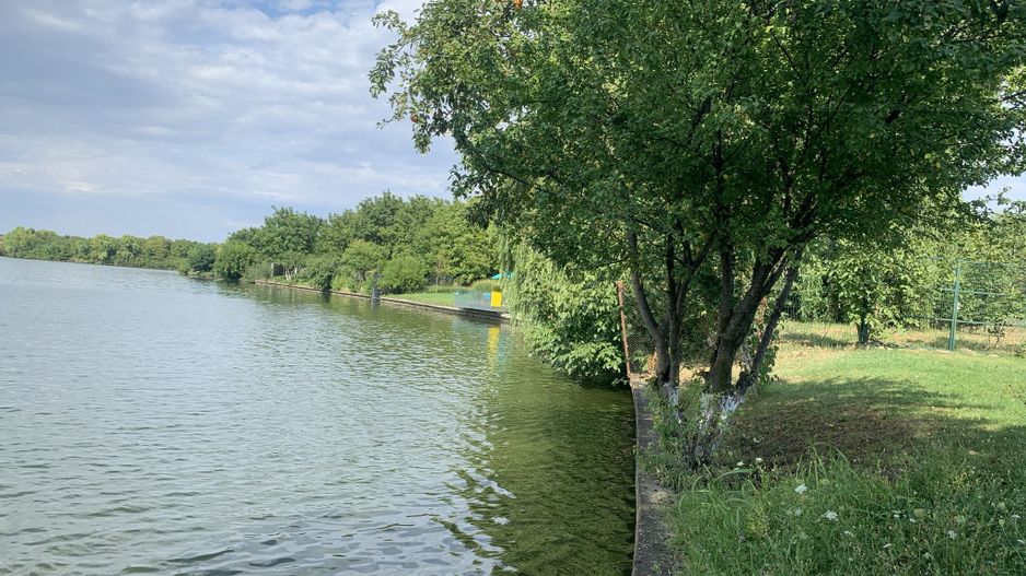 Teren 5963 mp deschidere lac Grivita 42 m cu deschidere la strazi 77 m - Poză 1