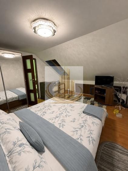 Se vinde apartament ( mansarda), 3 camere  74mp - Poză 2