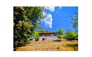 CASA TRADITIONALA, ANEXE si 46.980 mp teren partial INTRAVILAN - Poză 1