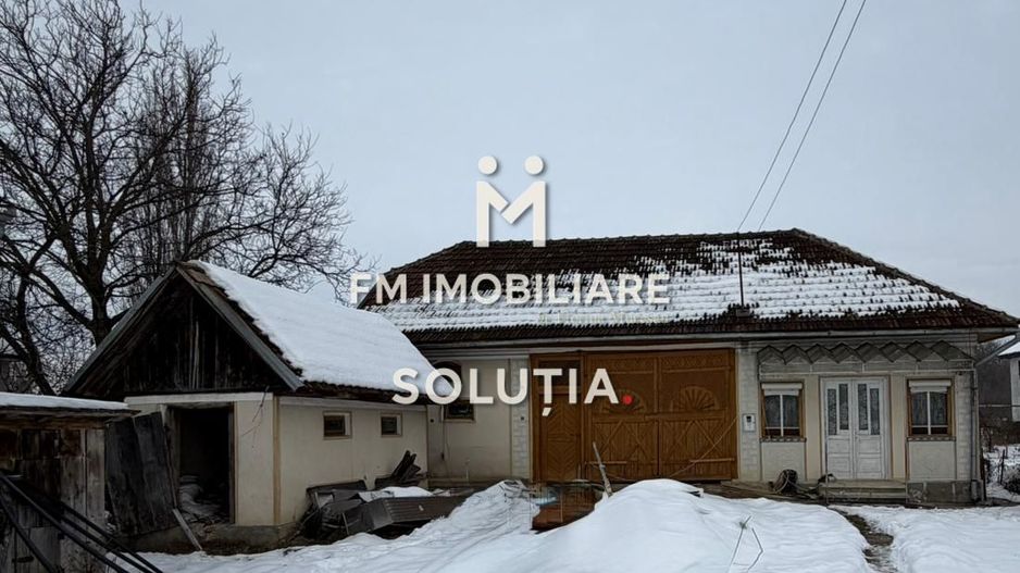 Casă cu teren generos în Buciumi - Poză 1