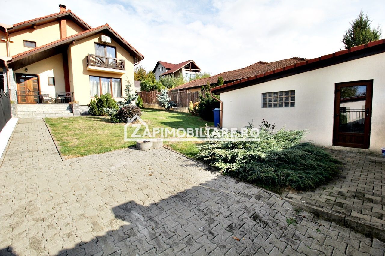 Casa 3 camere, 2 bai,1 garaj,teren 360 mp.zona Dambu Pietros - Poză 1