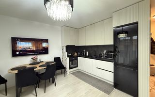 Locuință elegantă cu terasă generoasă și parcare subterană - Poză 1