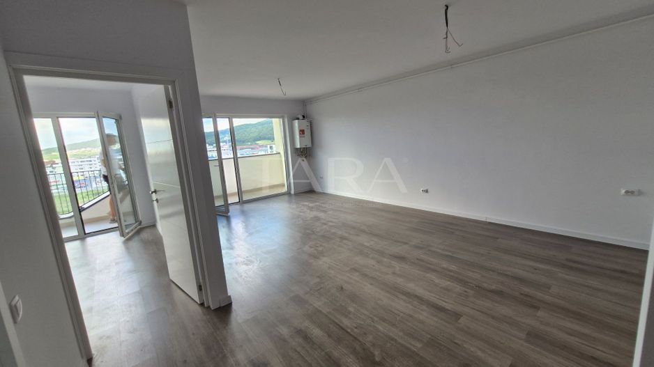 Apartament cu 2 camere, balcon 10 mp, parcare subterană inclusă. - Poză 1
