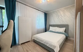 Casa P+1+M cu teren de 650 mp, piscina si curte complet amenajata - Poză 24