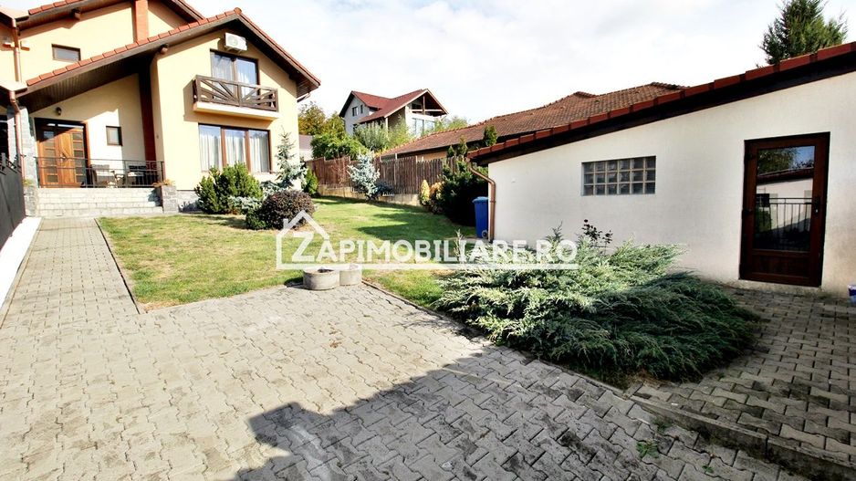 Casa 3 camere, 2 bai,1 garaj,teren 360 mp.zona Dambu Pietros - Poză 1