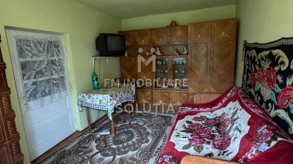 Casă cu teren generos în Buciumi - Poză 3