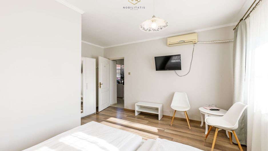 Proprietatea ideala pentru investiție, spații generoase, teren 1.200mp - Poză 4