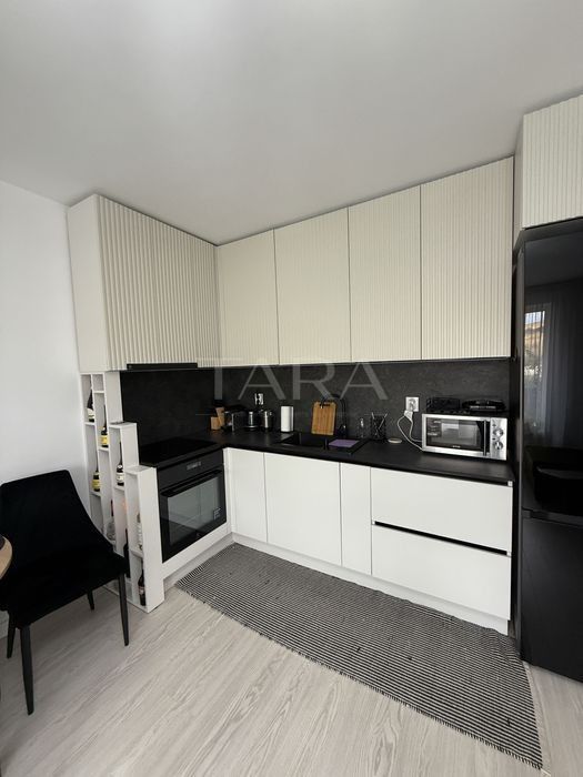Apartament cu 2 camere, ultarfinisat, mobilat, cu grădină proprie. - Poză 3