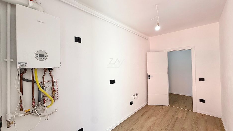 Ap pe 2 niveluri. Bucatarie inchisa, 2 bai. 2 locuri de parcare. - Poză 5