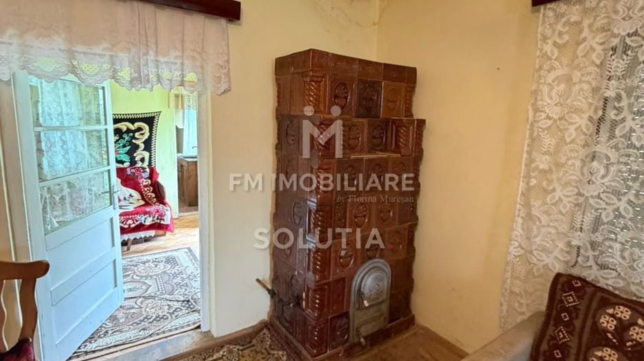 Casă cu teren generos în Buciumi - Poză 12