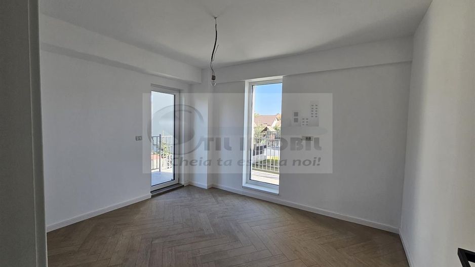 Apartament exclusivist dispus P+1E + curte 70mp - Poză 9